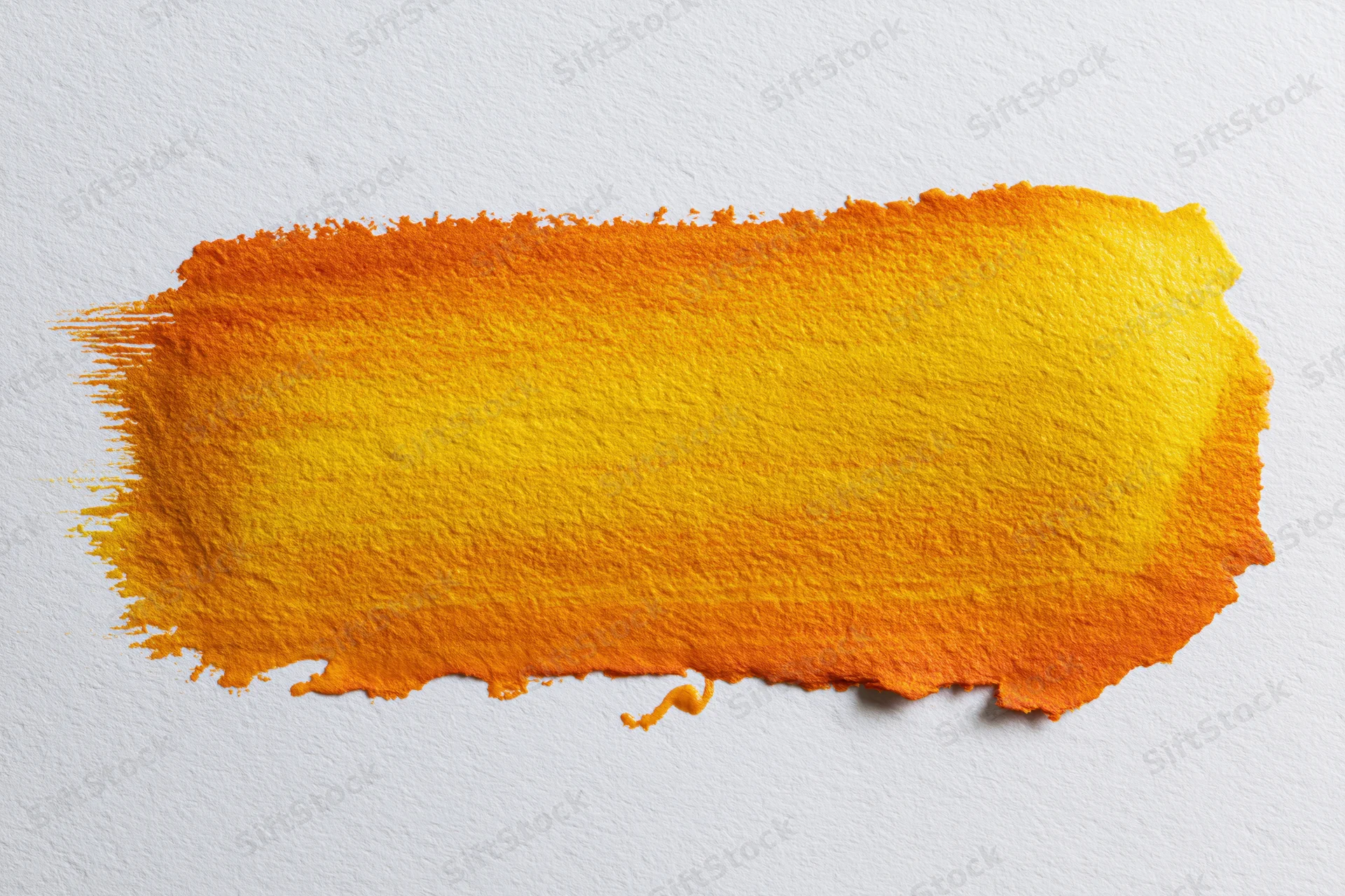 Horizontal watercolor brushstroke blending orange and yellow on textured white paper