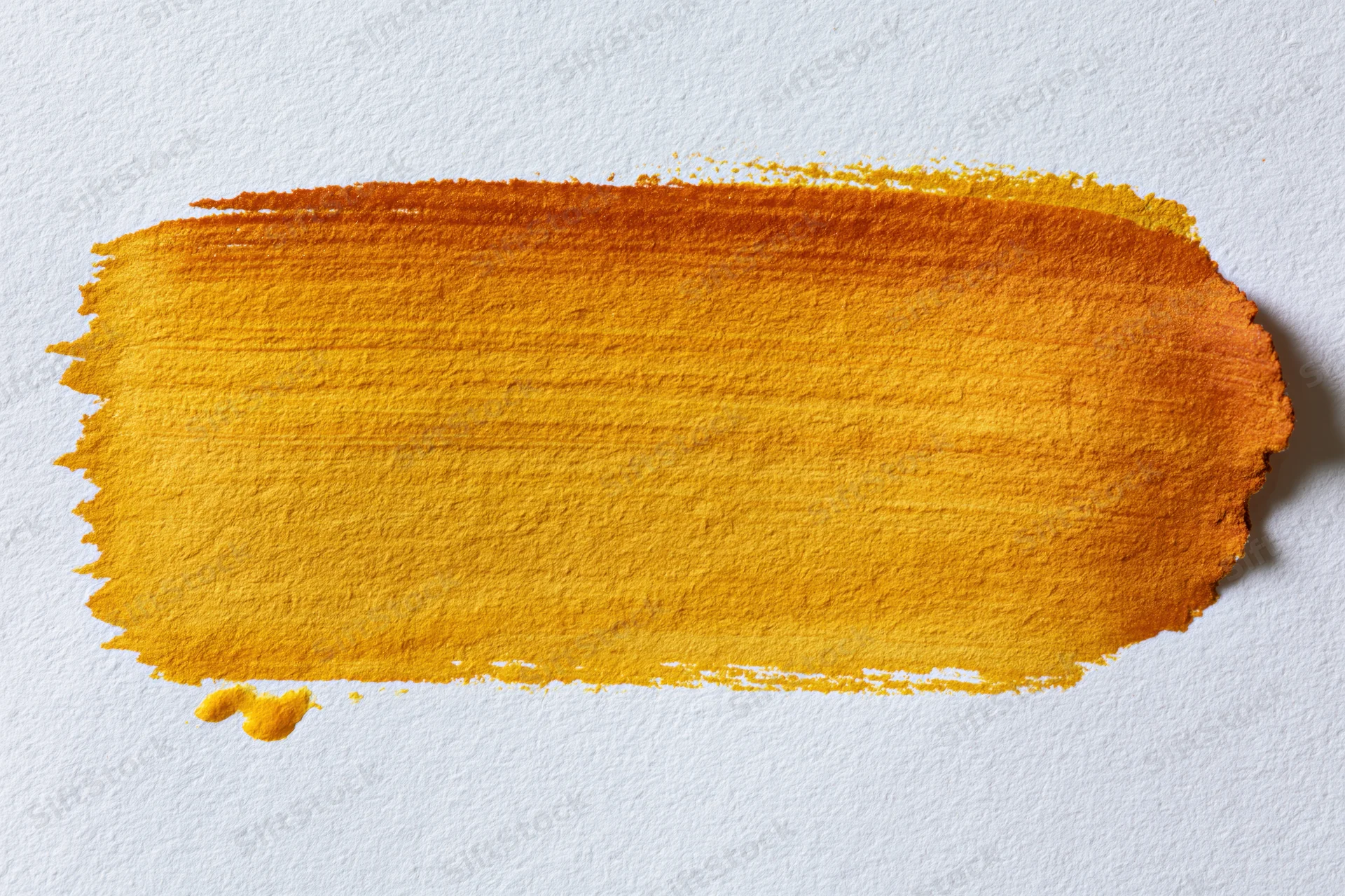 Horizontal watercolor brushstroke in yellow and orange gradient on textured white paper