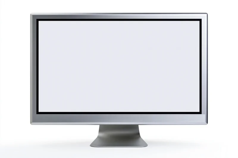 Slim desktop computer monitor with blank white screen on white background