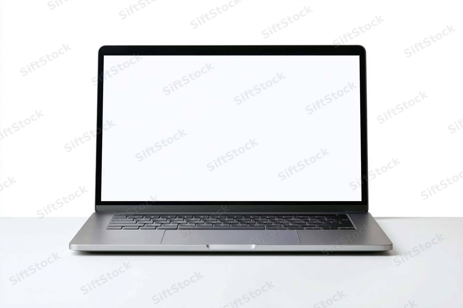 Slim modern laptop with blank white screen open on white surface