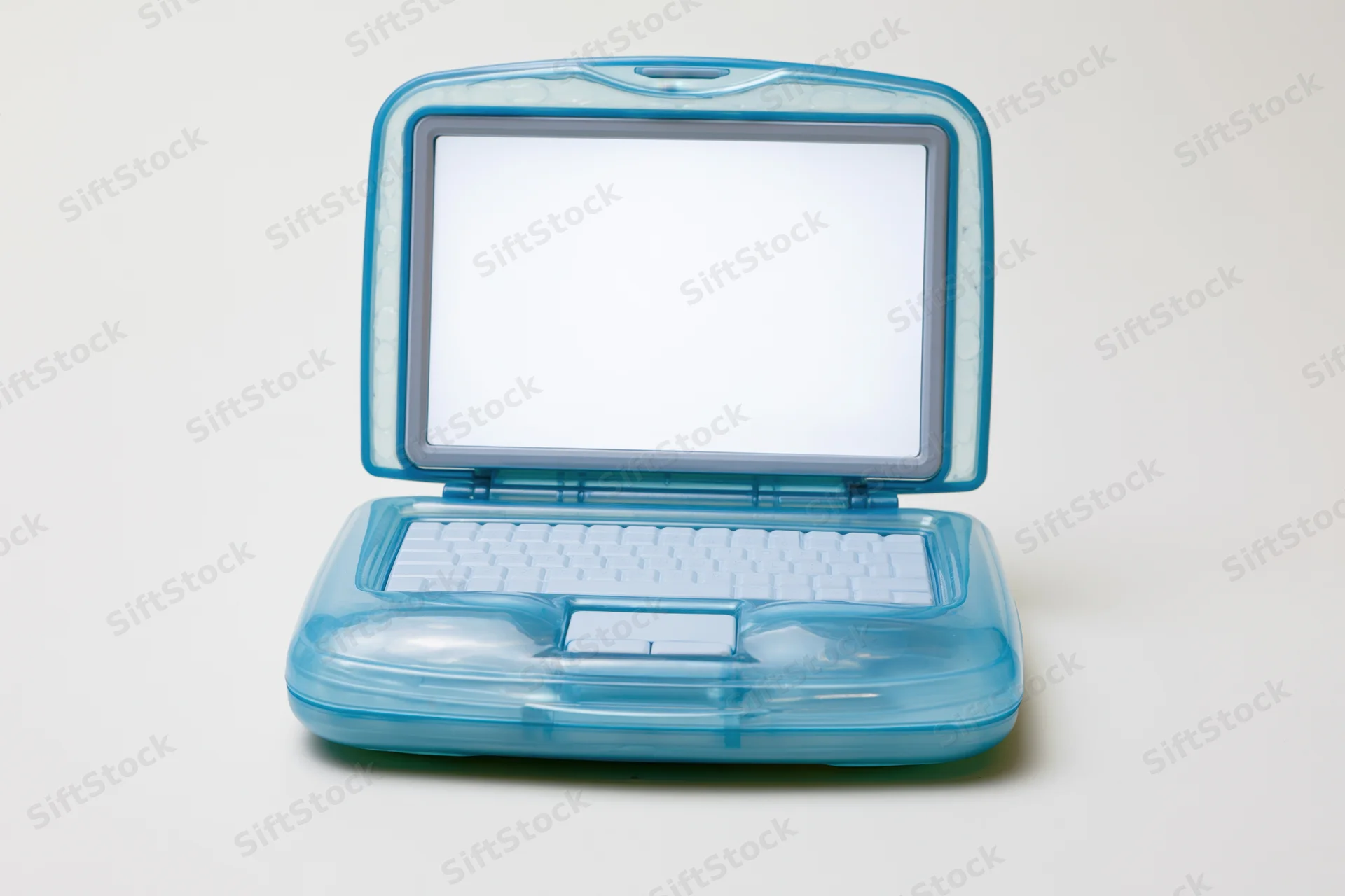 Translucent blue plastic childrens toy laptop open on white background