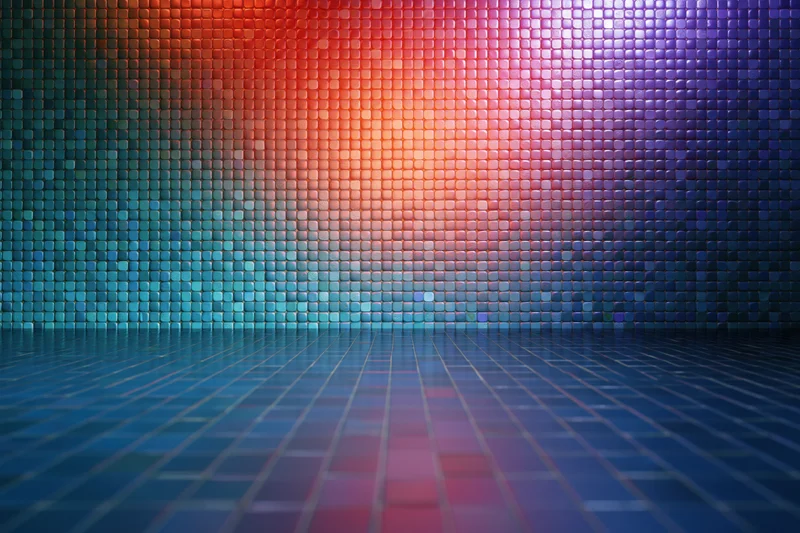 Colorful mosaic tile wall radiating light with reflective floor in studio space