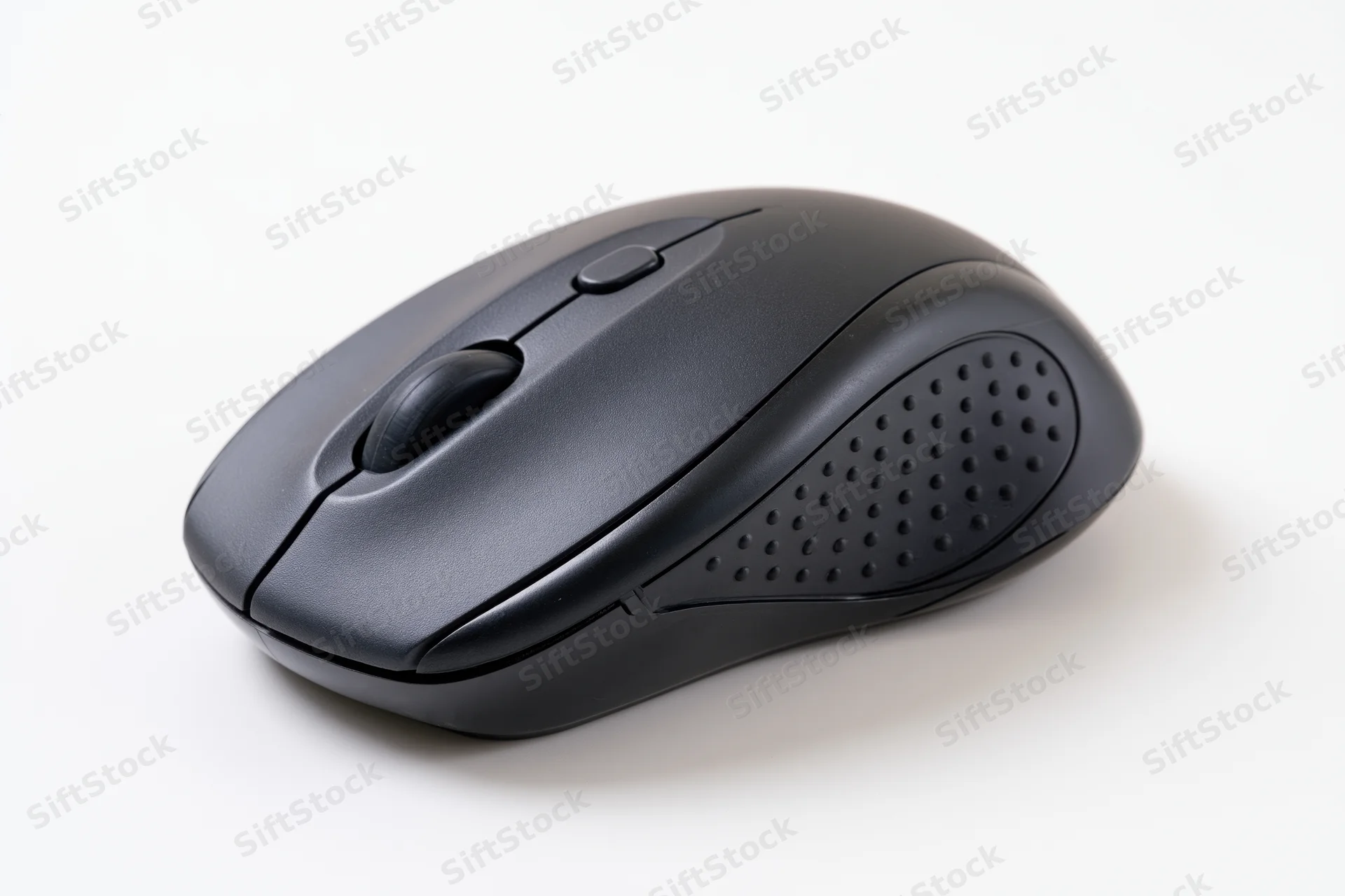 Black wireless computer mouse on plain white surface