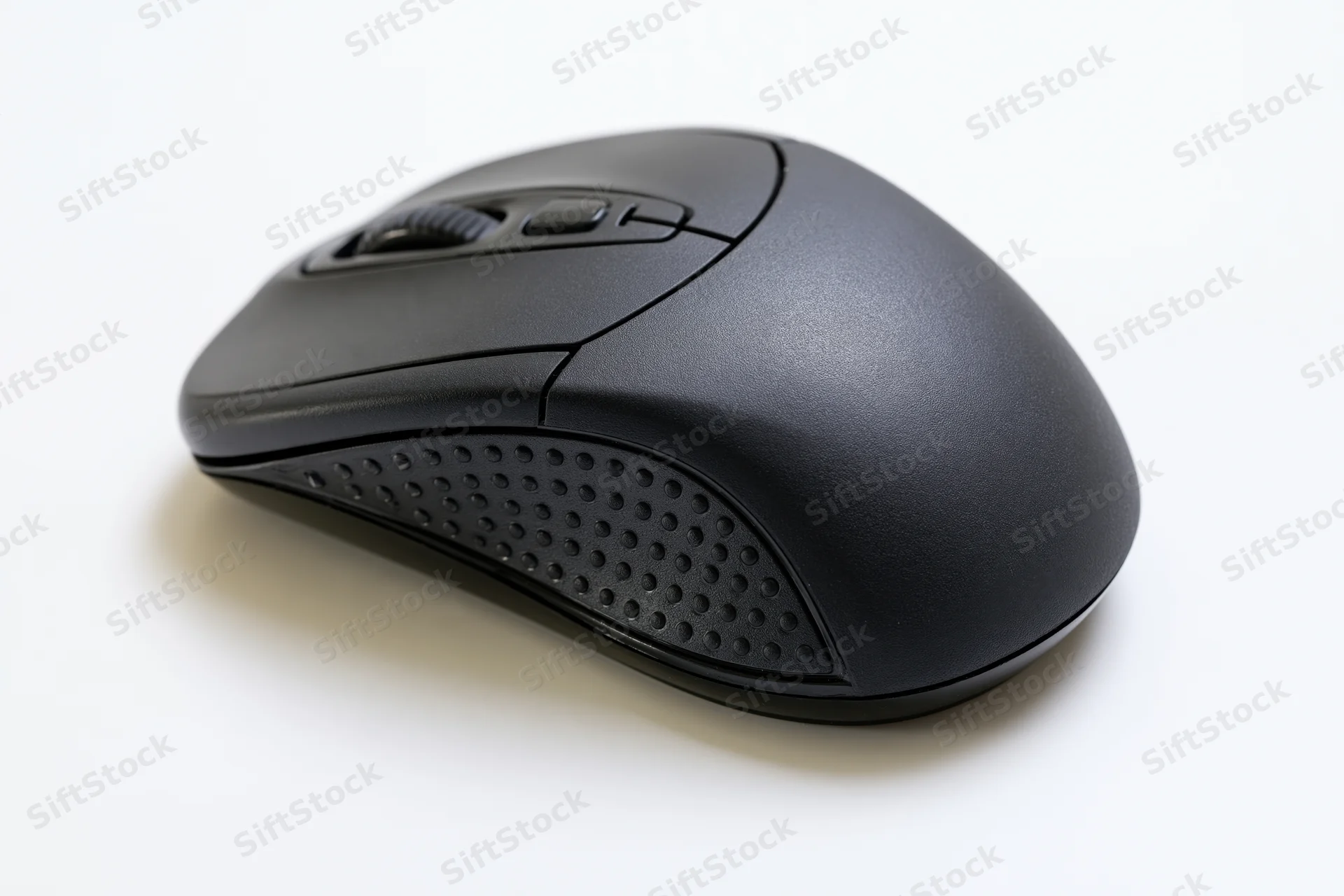 Black wireless computer mouse on plain white surface