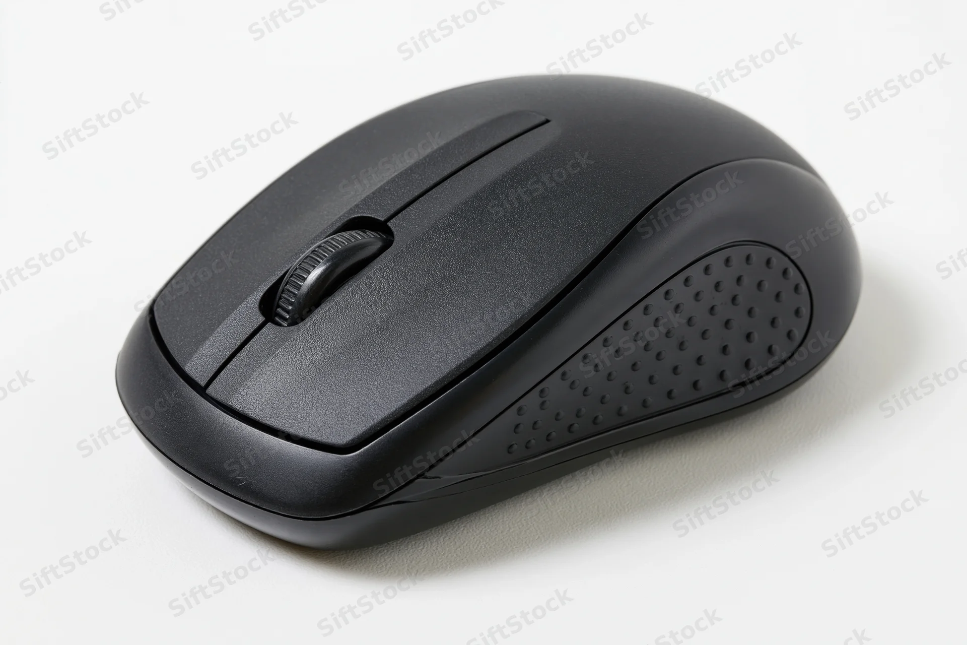 Black wireless computer mouse on plain white surface