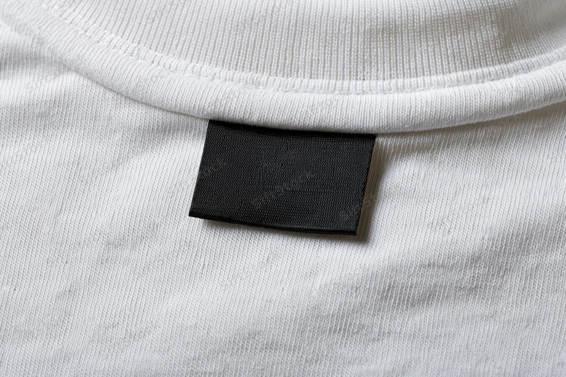 Blank black label sewn inside white tshirt collar