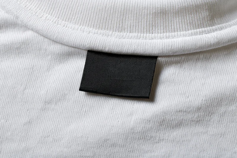 Blank black label sewn inside white tshirt collar