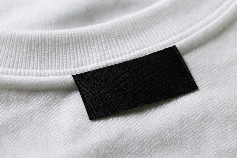 Blank black label sewn inside white tshirt collar