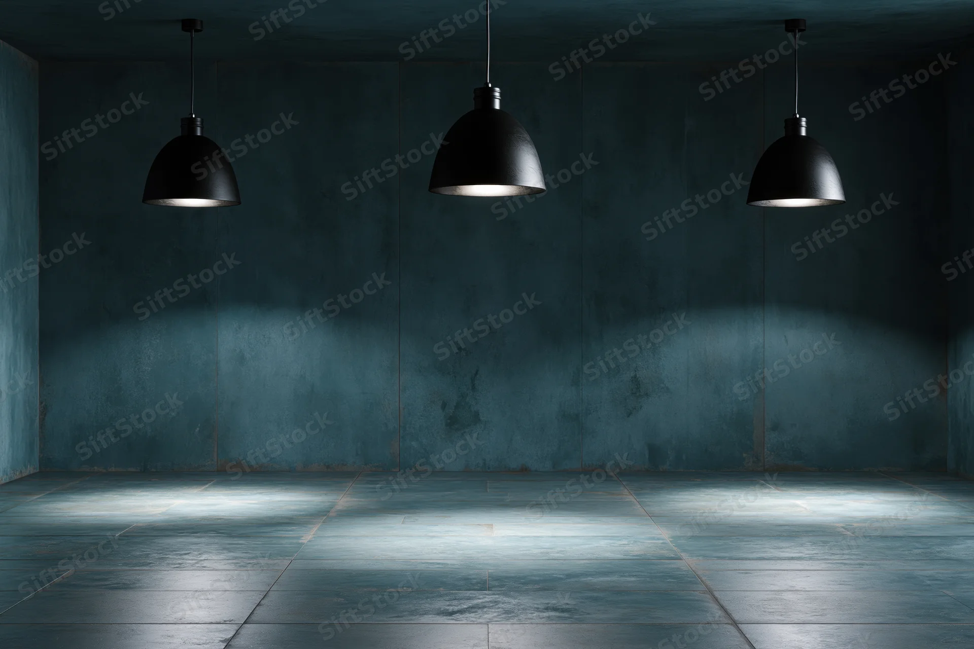 Empty industrial room with three black pendant lamps hanging from ceiling, casting light on concrete floor and walls