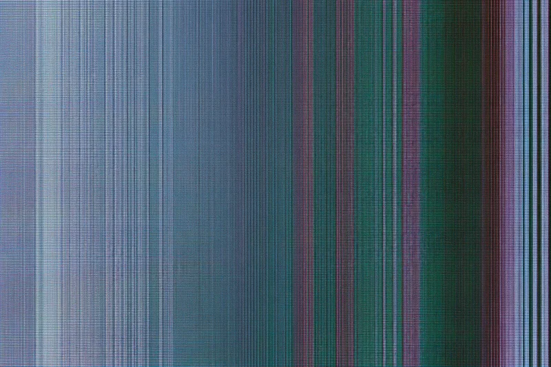 Extreme close-up of lcd screen surface showing pixel grid and color stripes
