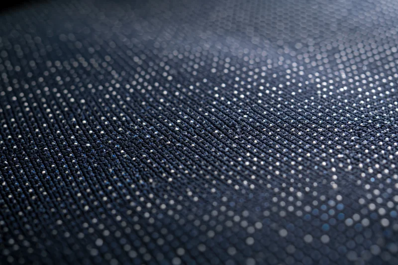 Close-up of led display panel surface showing pixel grid and light dots