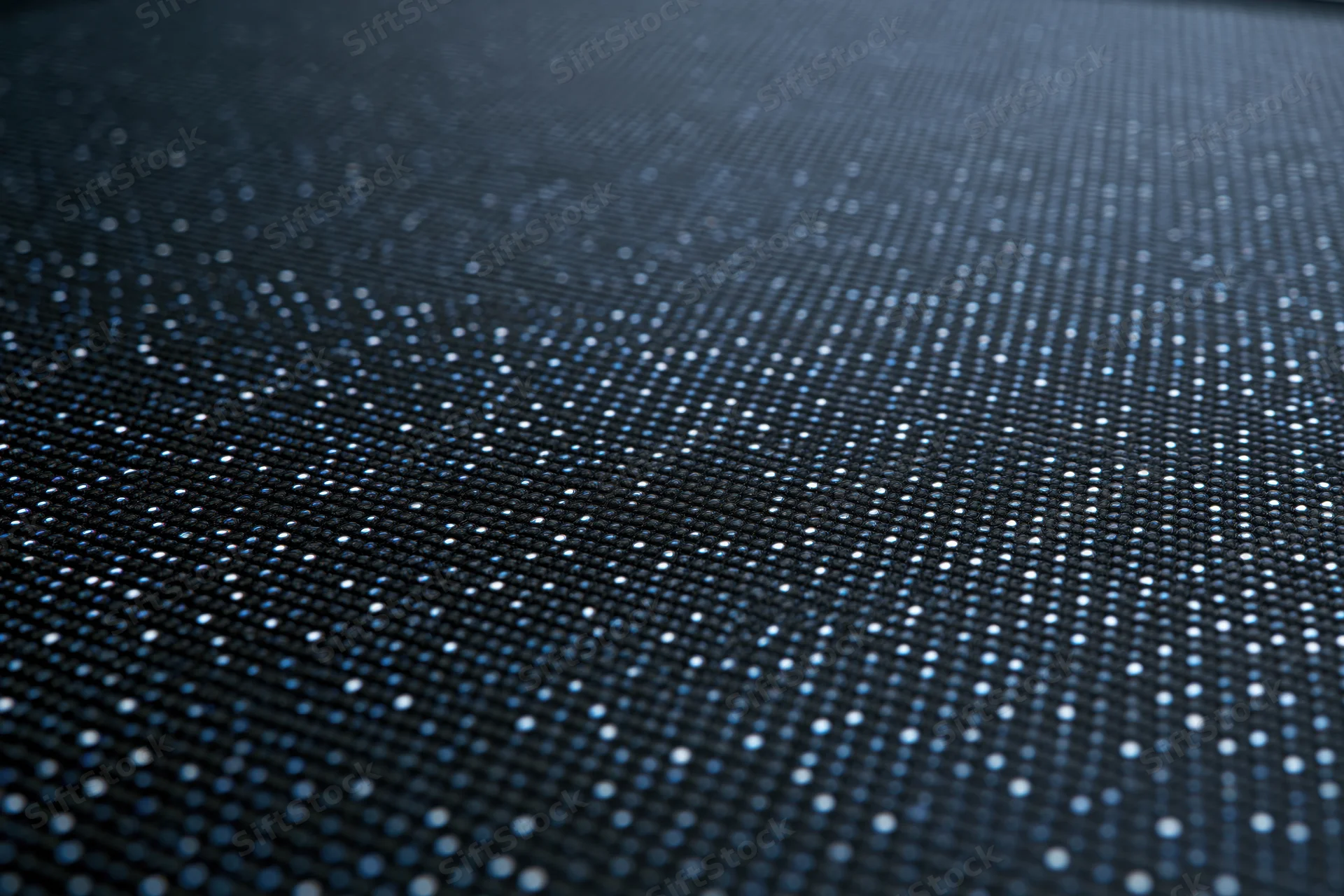 Close-up of led display panel surface showing pixel grid and illuminated dots