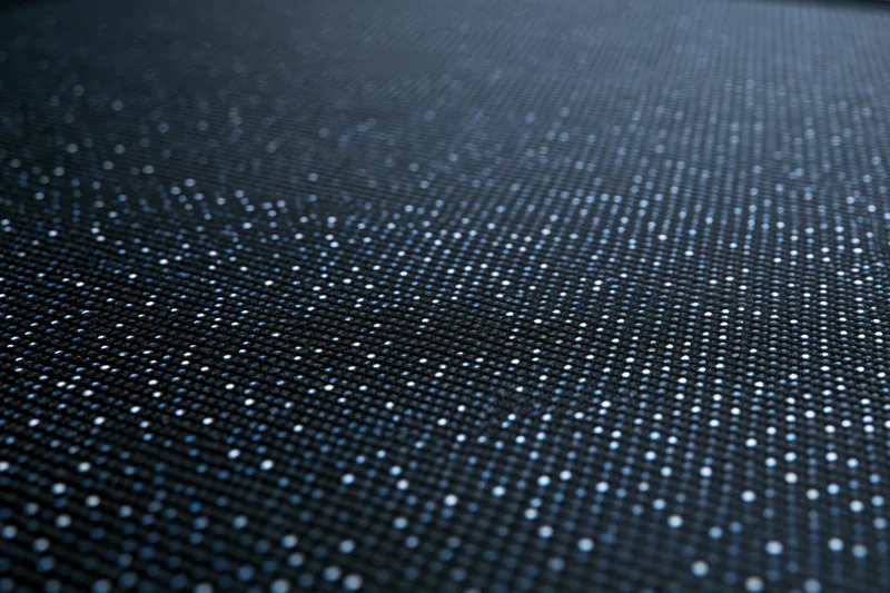 Close-up of led display panel surface showing pixel grid and illuminated dots