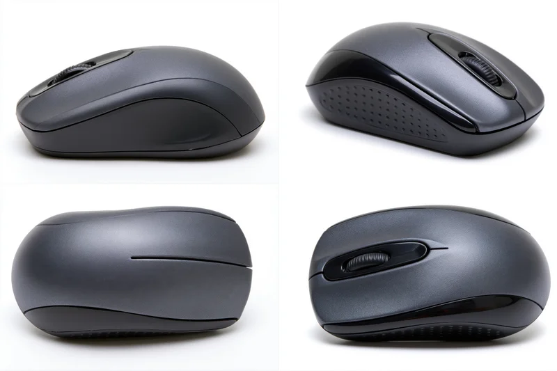Four views of a dark grey wireless computer mouse on white background