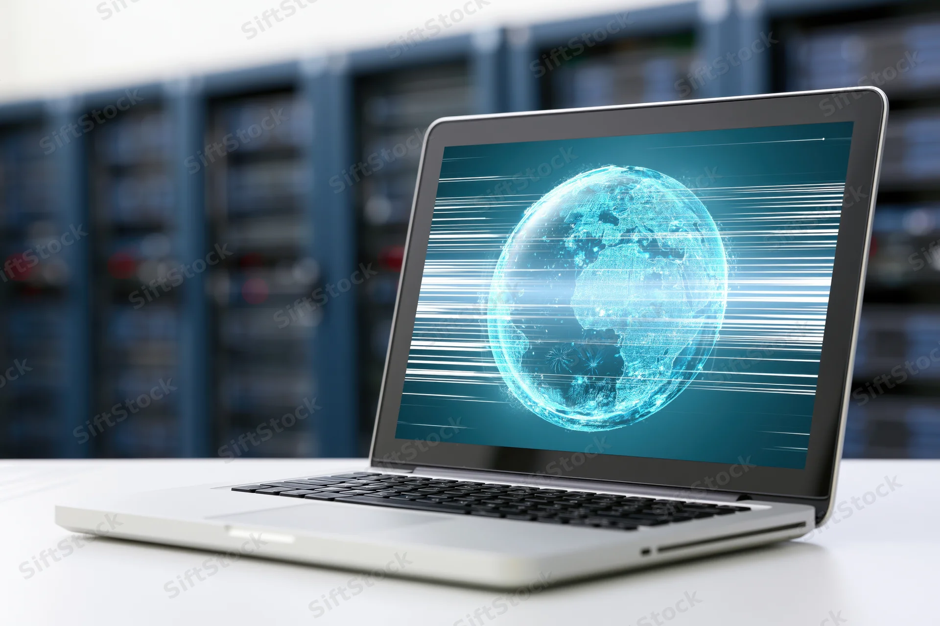 Laptop displaying digital globe on screen in front of server racks