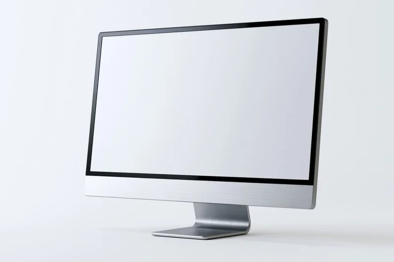 Modern all-in-one desktop computer monitor with blank white screen on white background