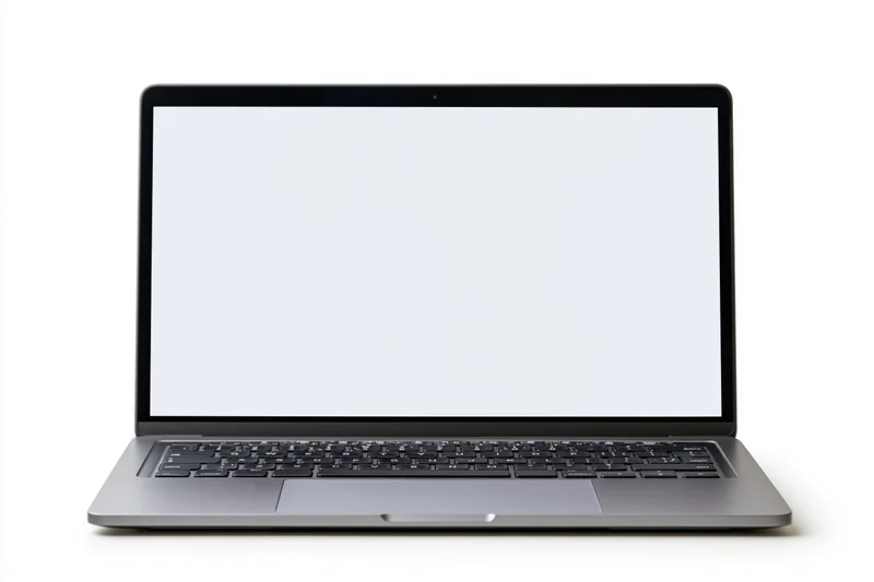 Open silver laptop with blank white screen on white background