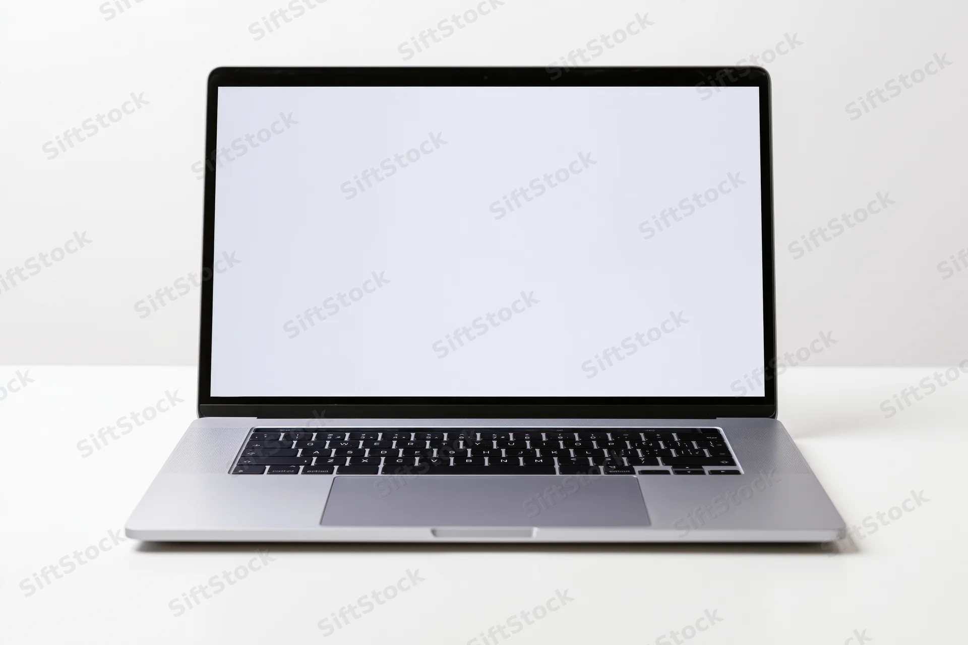 Modern slim laptop with blank white screen open centered front view on white surface