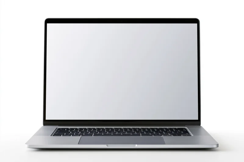 Silver laptop open with blank screen on white background