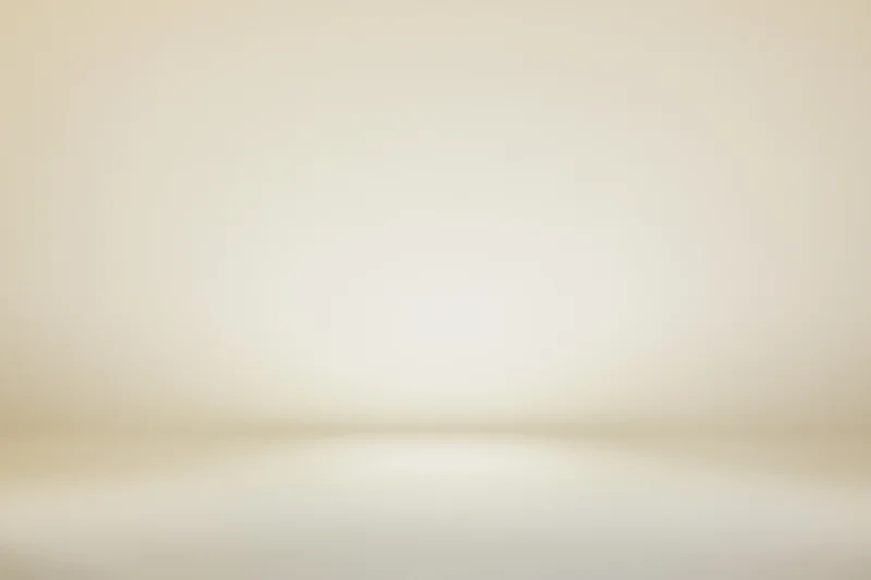 Plain off-white studio background with soft radial vignette and copyspace