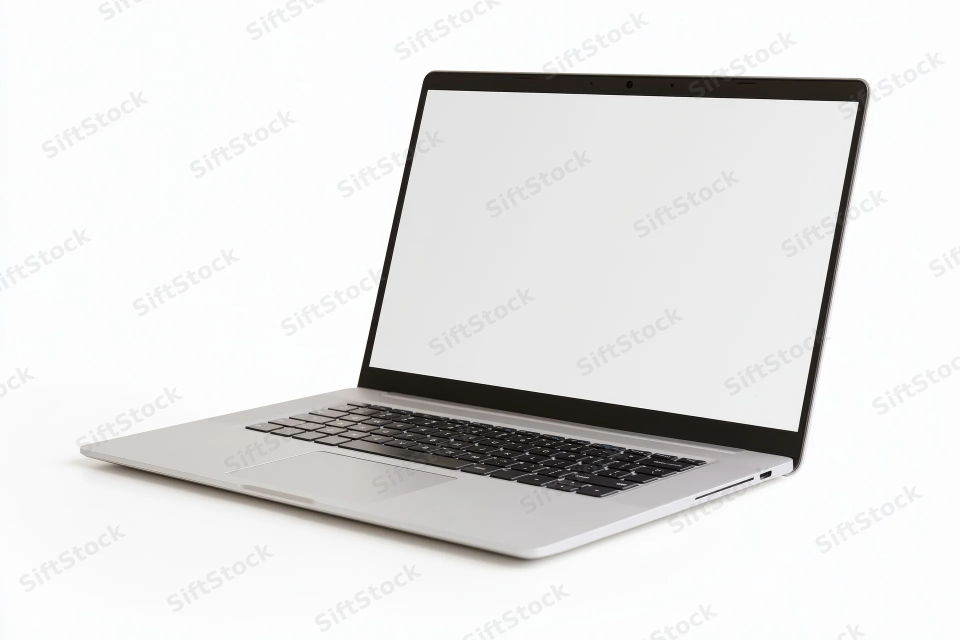 Silver aluminum laptop open at an angle with blank white screen on white background