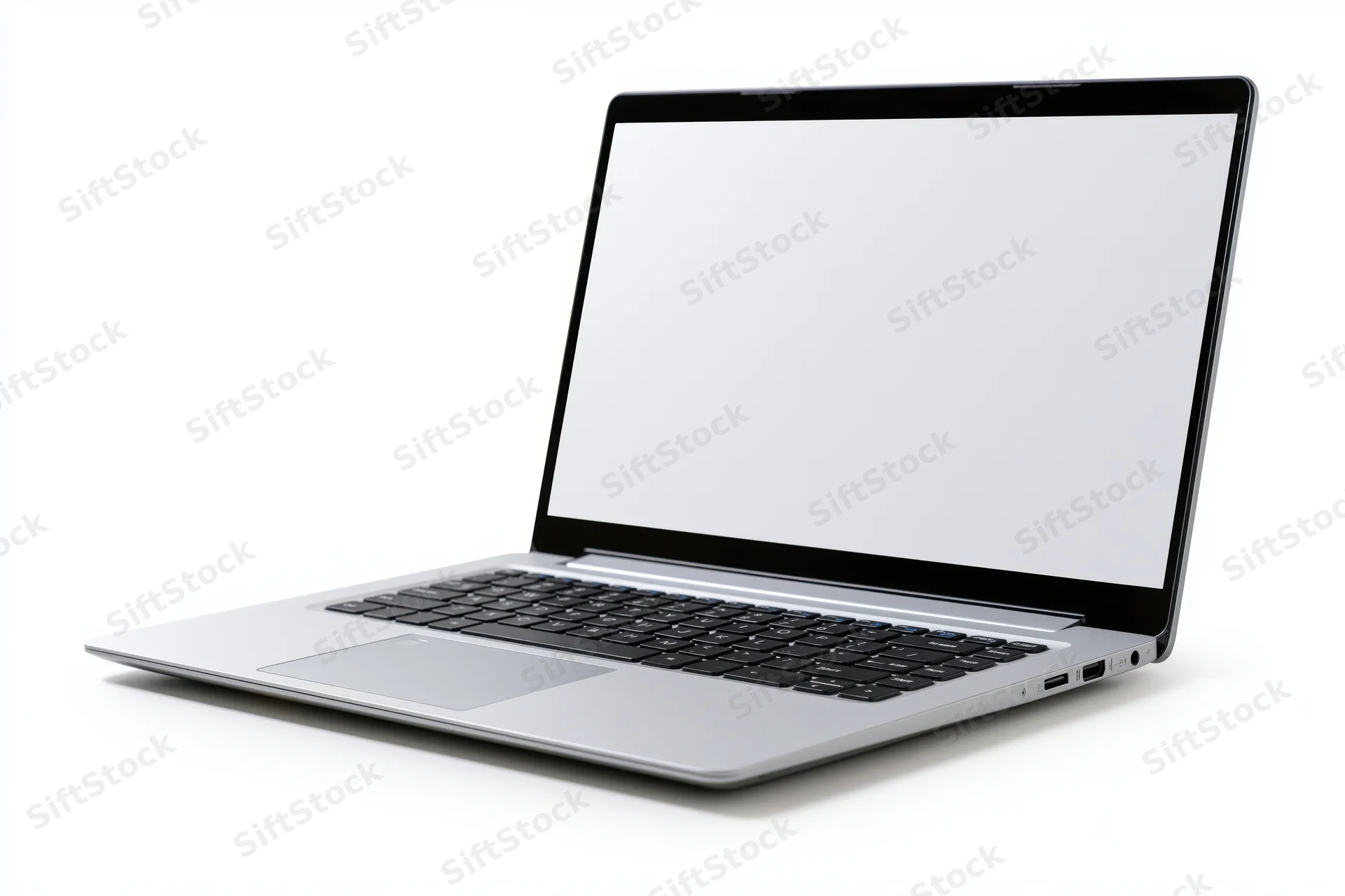 Silver laptop with blank white screen open at an angle on white background