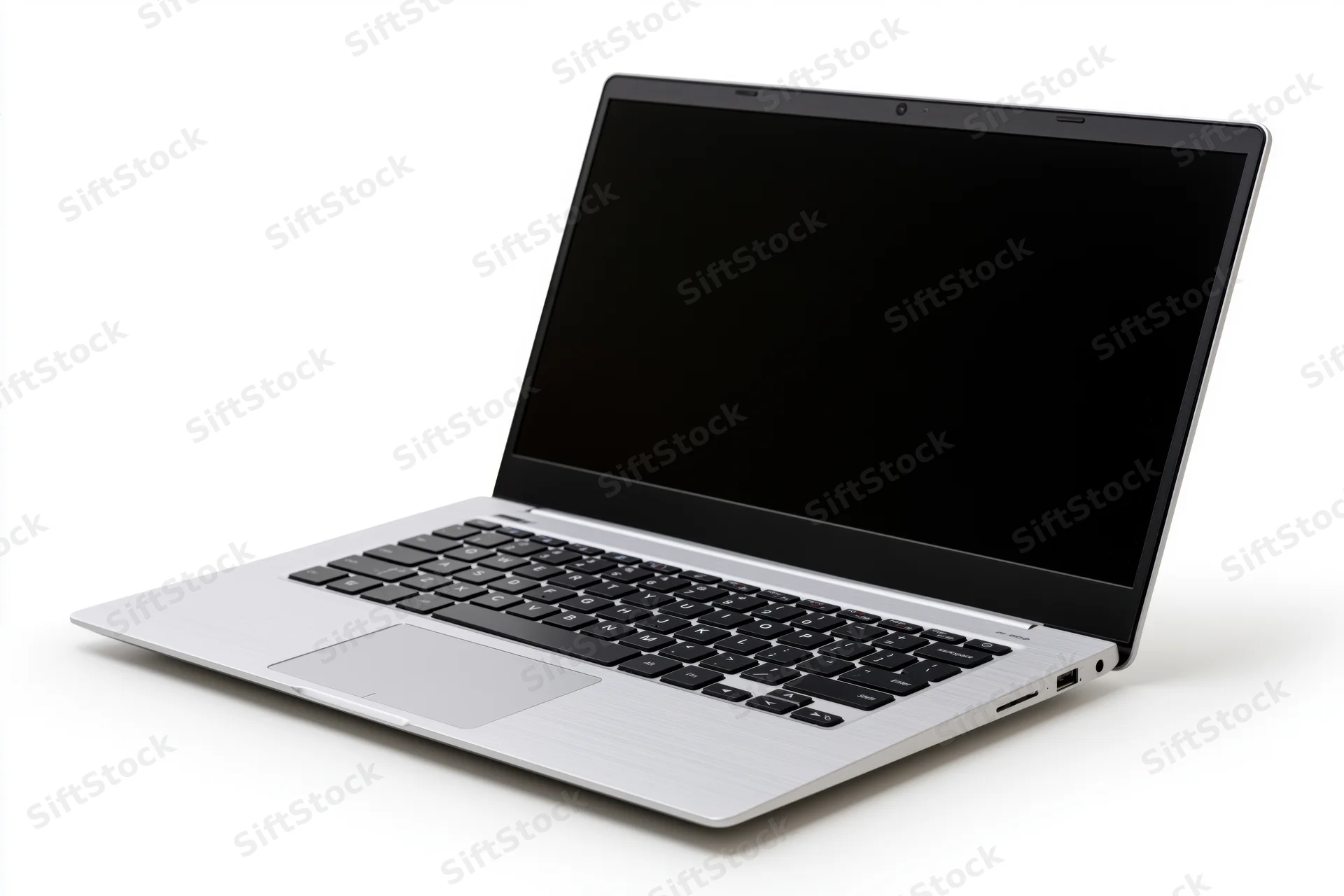 Silver aluminum laptop open with blank black screen on white background