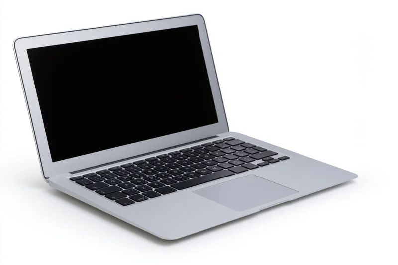 Silver aluminum laptop open with blank black screen on white background
