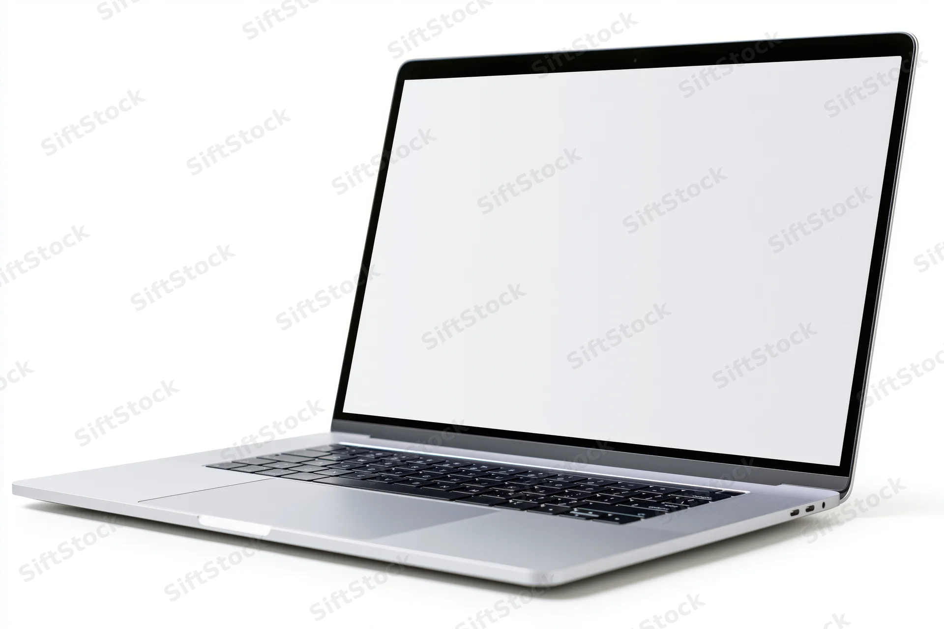 Silver aluminum laptop open with blank white screen on white background