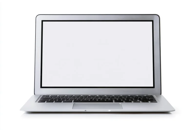 Silver aluminum laptop open facing forward with blank white screen on white background