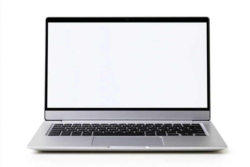 Silver aluminum laptop open facing forward with blank white screen on white background