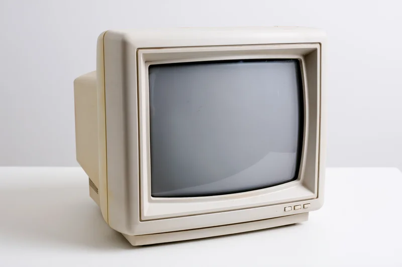Vintage crt computer monitor on white surface