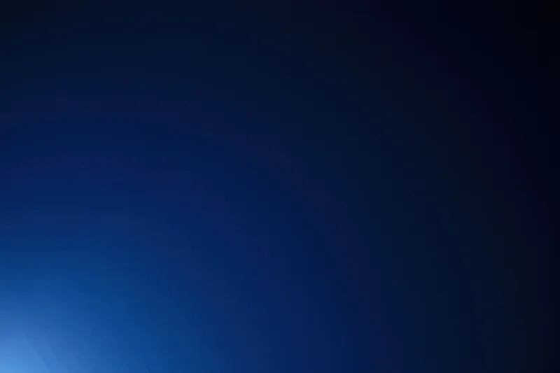Smooth dark navy blue gradient background with tonal transition