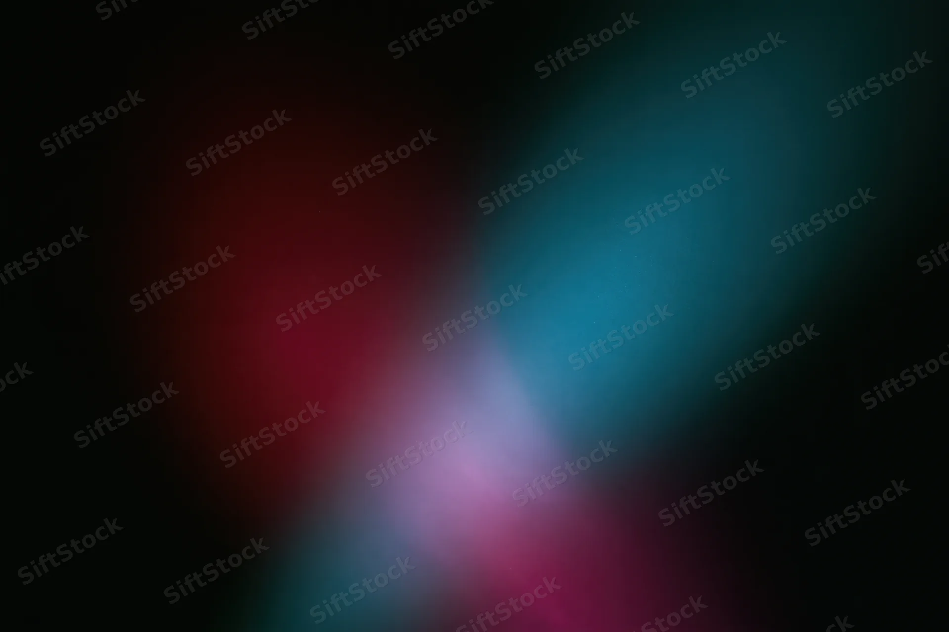 Abstract stage lighting bleed on dark wall with overlapping red and blue hues