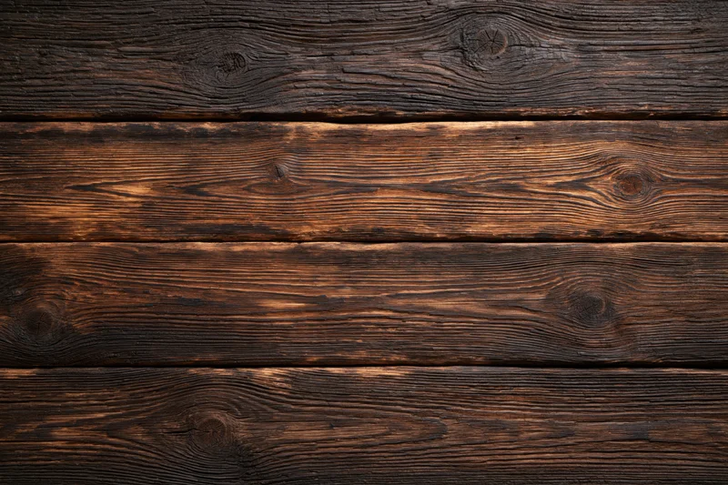 Horizontal aged dark wooden planks forming a textured surface