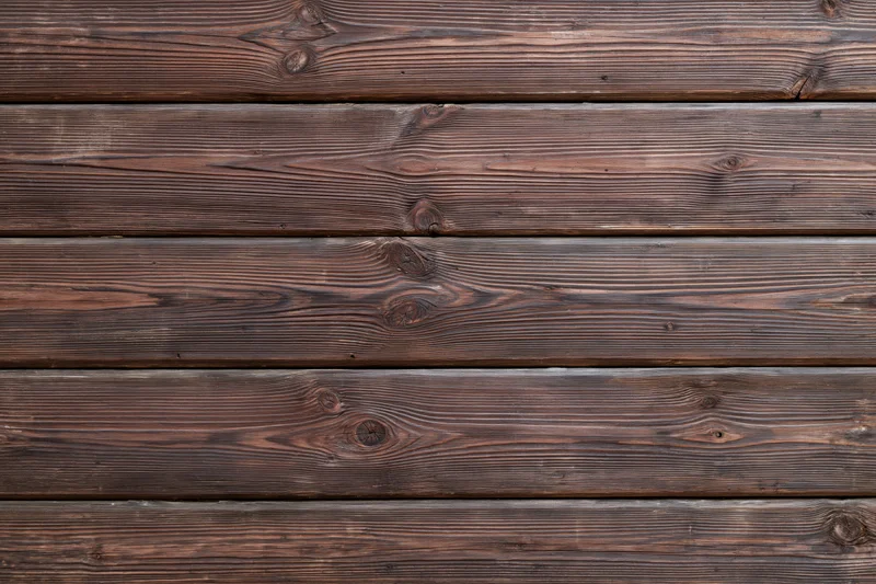 Horizontal aged wooden planks filling the frame as a textured surface