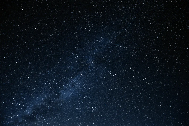 Clear night sky with scattered stars and visible milky way