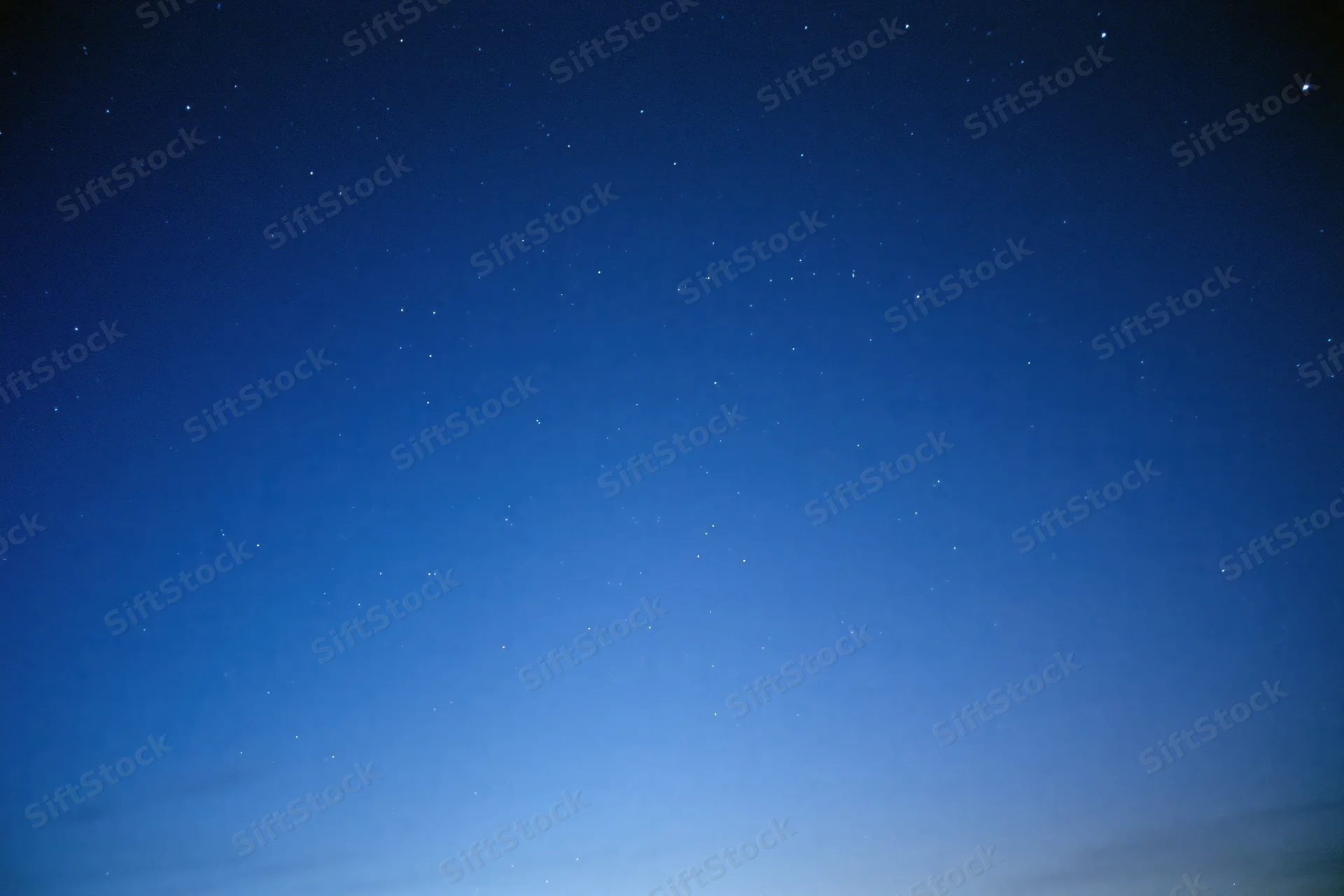 Clear night sky filled with scattered faint stars, no horizon visible