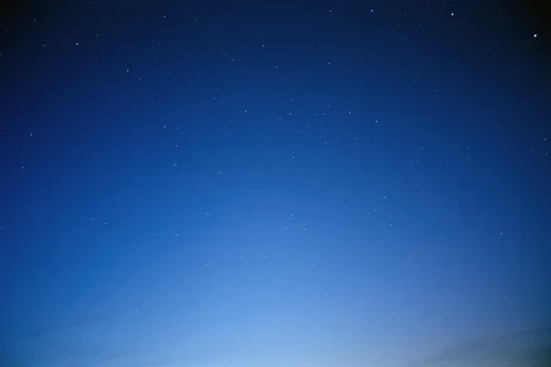 Clear night sky filled with scattered faint stars, no horizon visible