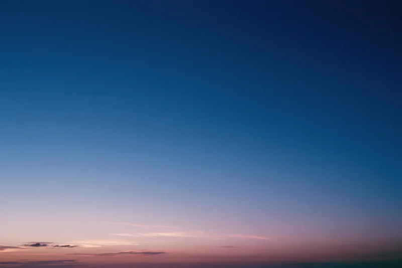 Twilight sky with soft blue and pink gradient transitioning from dusk to evening