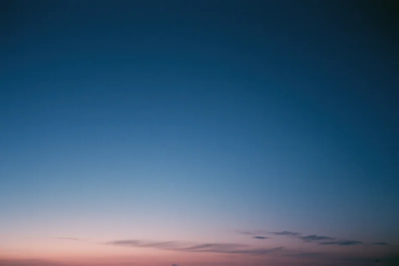 Twilight sky with soft blue and pink gradient transitioning from dusk to evening