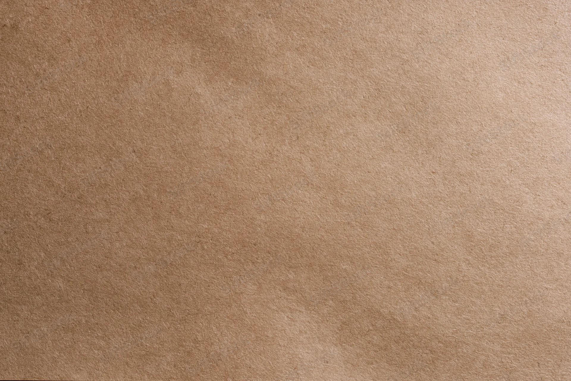Close-up flat lay of smooth matte brown kraft paper surface