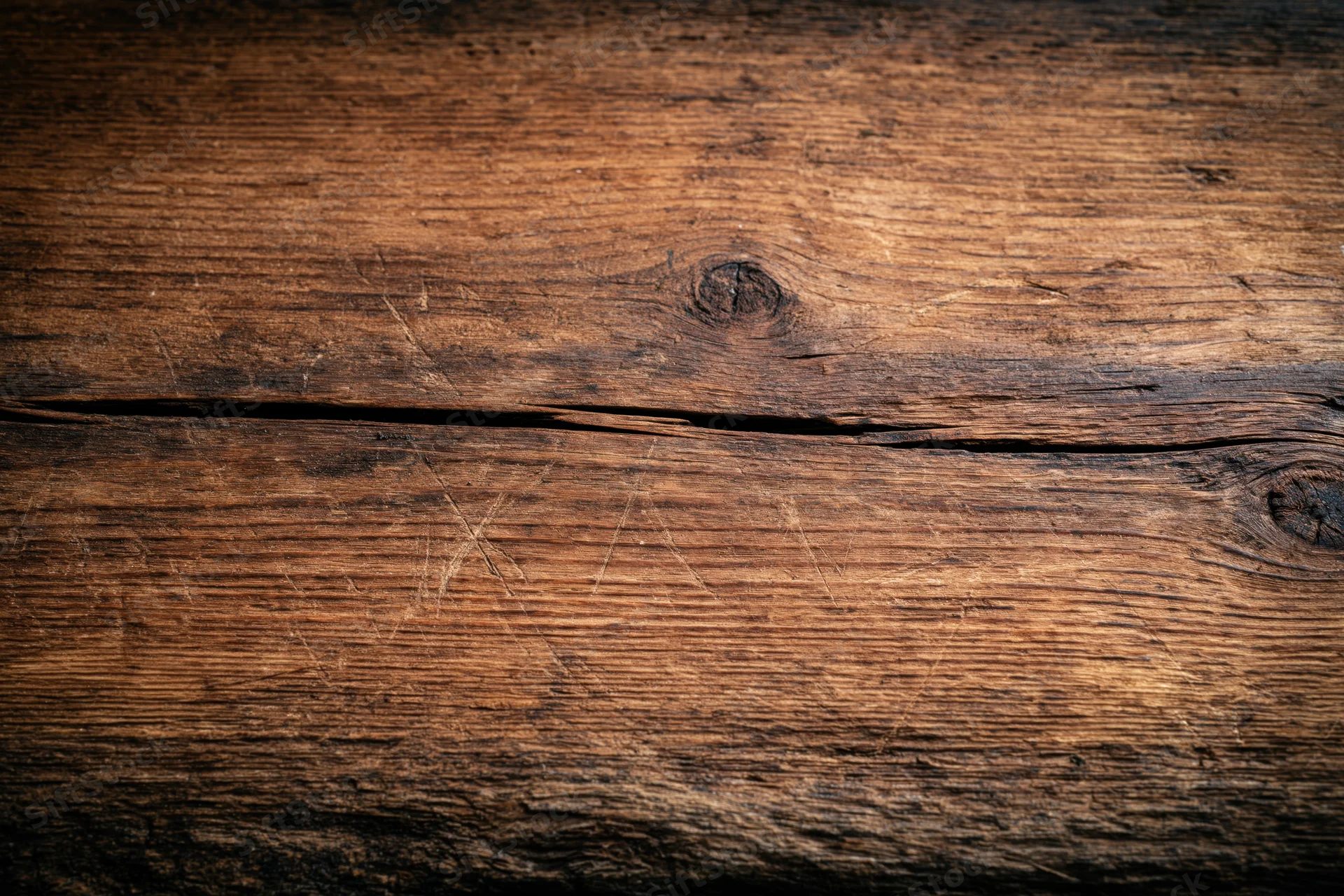 Close-up of weathered wooden surface with visible grain and knots, flat lay arrangement