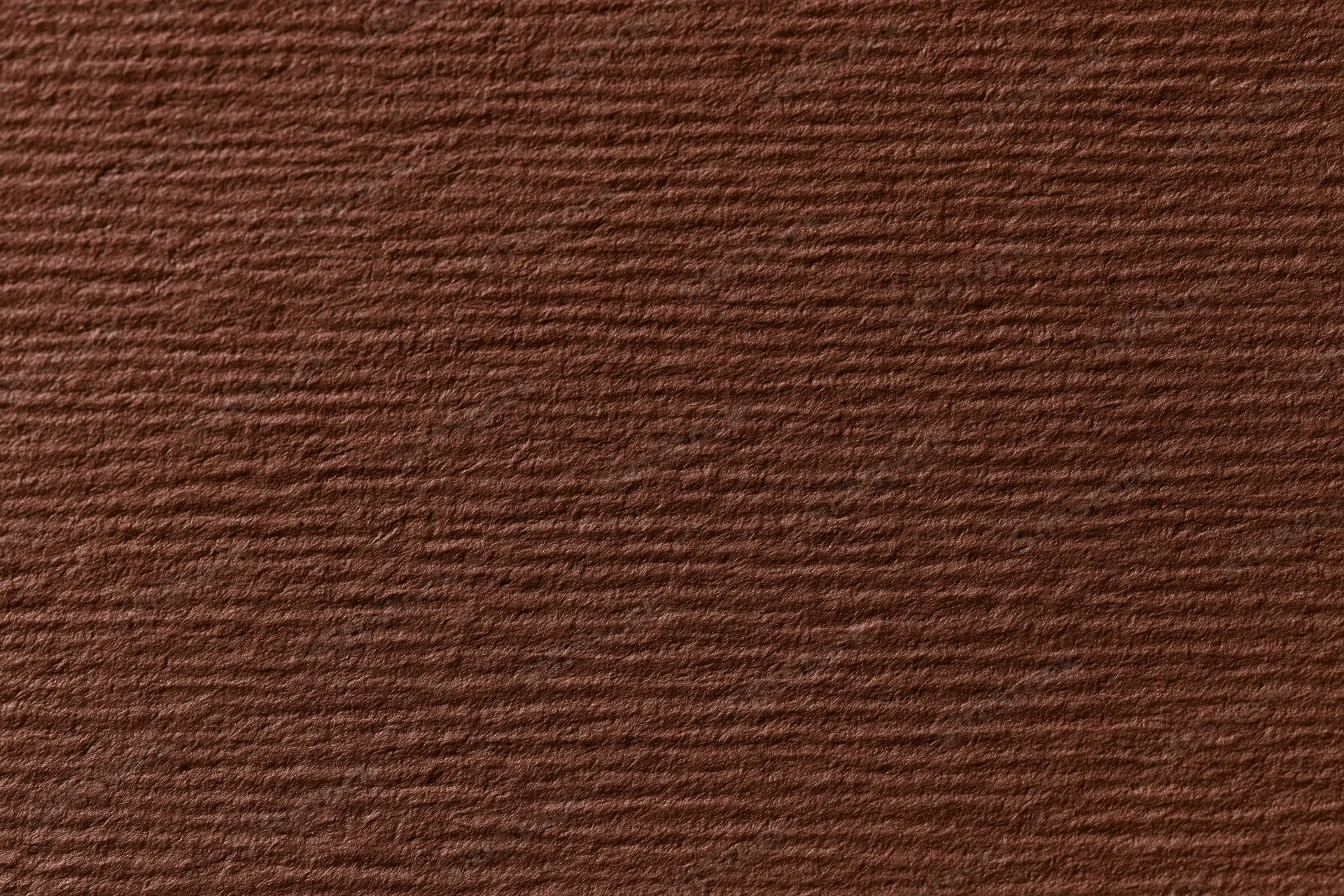Close-up flat lay of dark brown textured cardstock paper surface