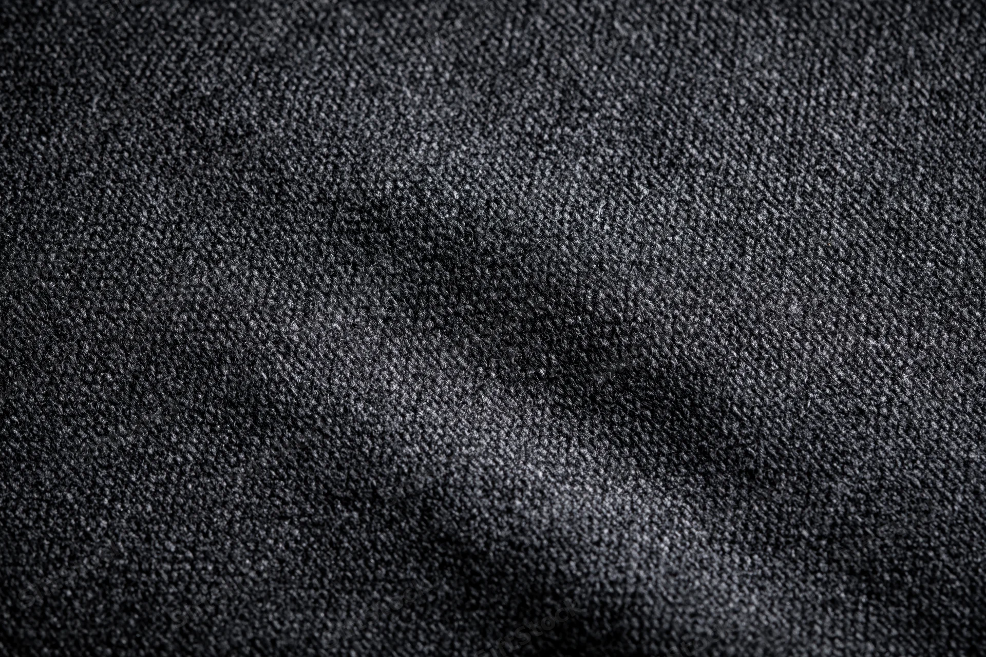 Close-up of dark charcoal woven fabric texture filling the frame