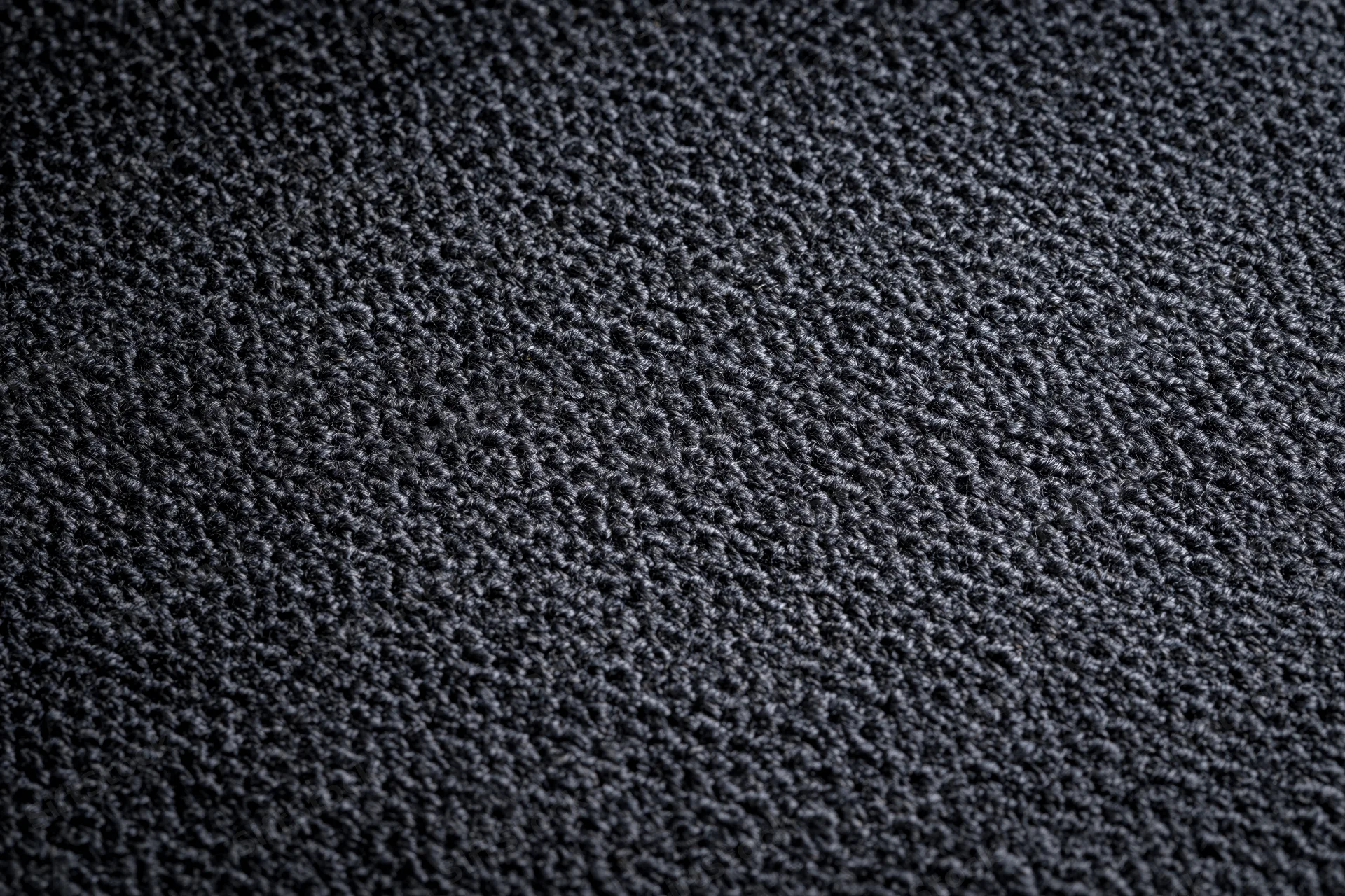 Close-up of dark charcoal woven fabric texture filling the frame