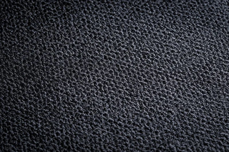 Close-up of dark charcoal woven fabric texture filling the frame