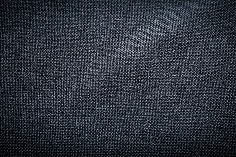 Close-up of dark charcoal woven fabric texture filling the frame