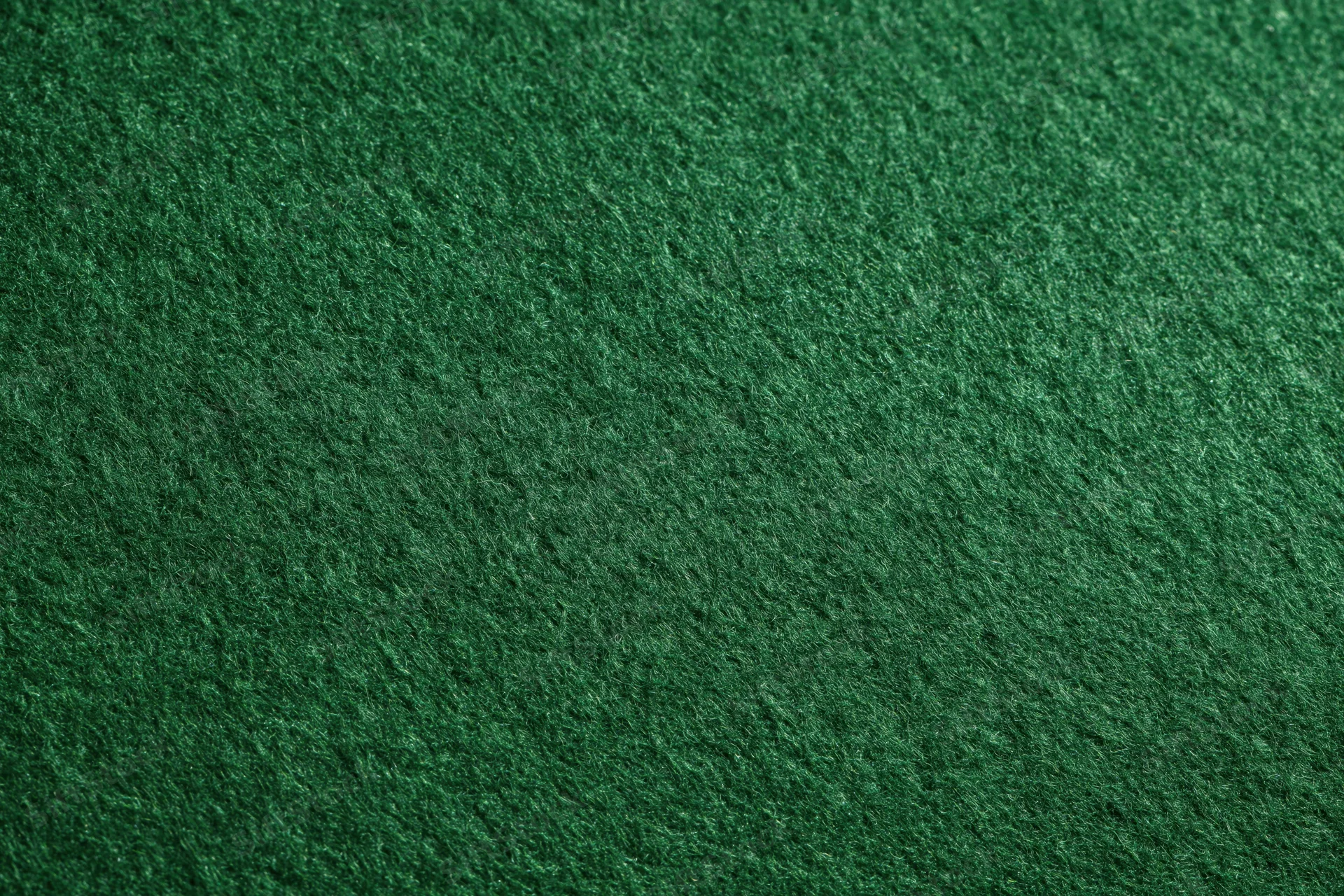Close-up of dark green felt fabric surface filling the frame