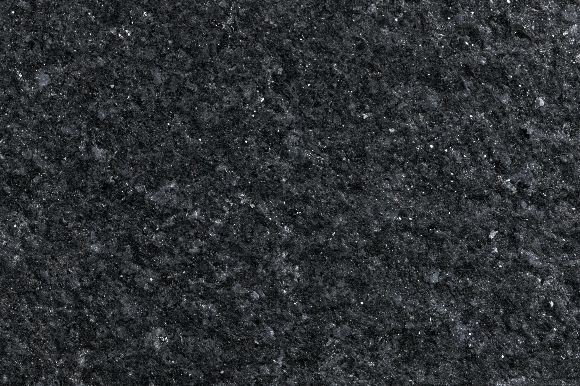 Close-up of polished black granite surface texture
